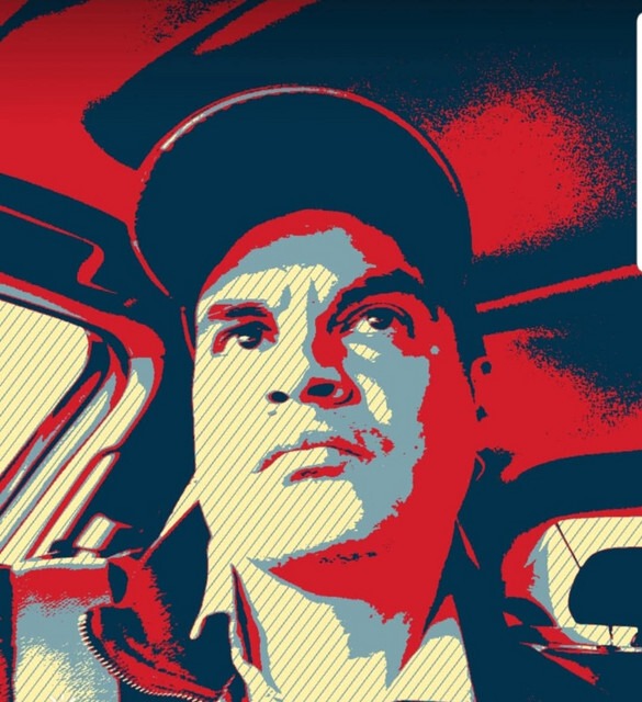 A stylized portrait of a man in a car, featuring bold red and blue tones, emphasizing a serious expression. The image conveys a sense of intensity and focus.