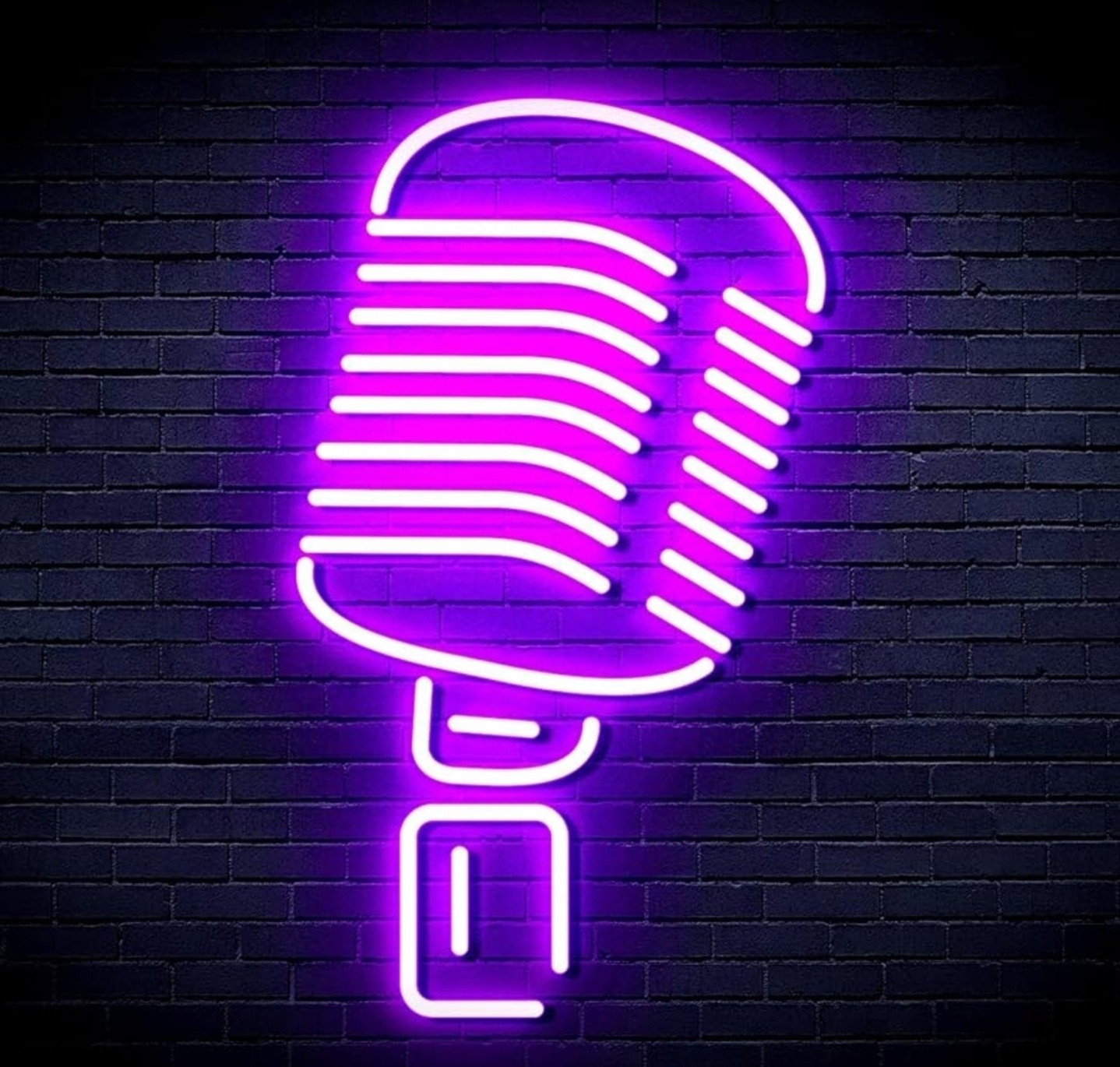 Neon purple microphone sign illuminating a dark brick wall, symbolizing music or broadcasting, relevant for events or creative content.